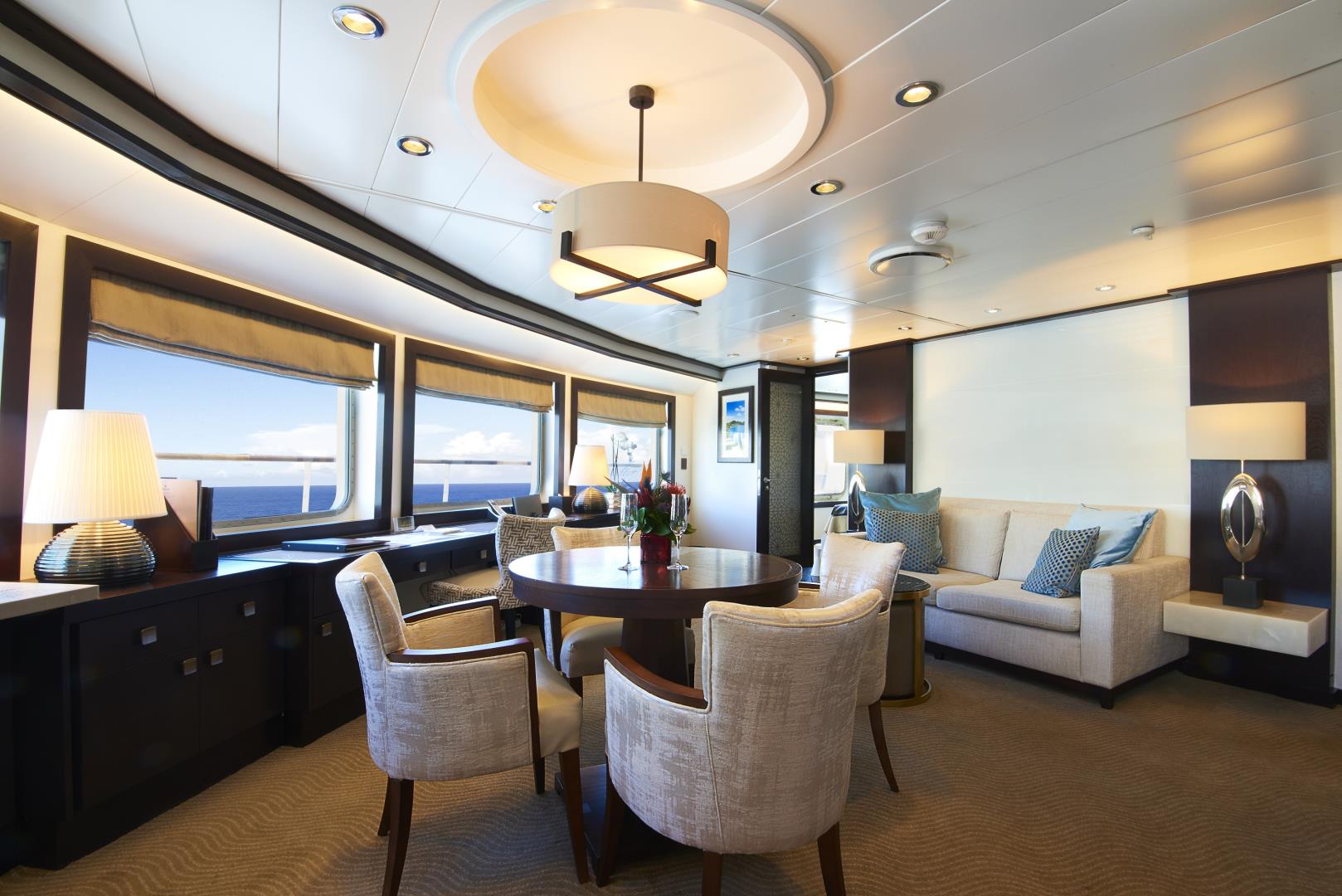View of dining table and living area in Star Pride suite - Photo Credit: Gil Stose Photography